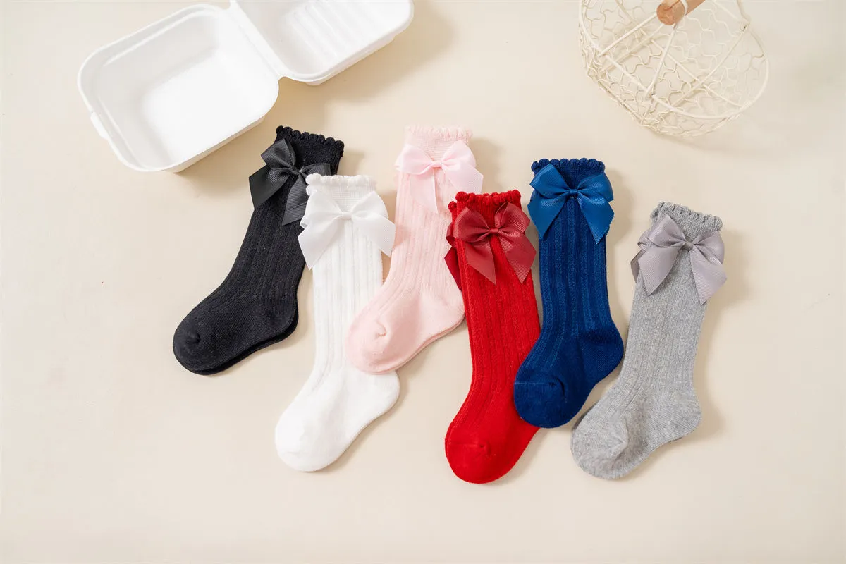 Baby girls knee high bow socks available in multiple colors