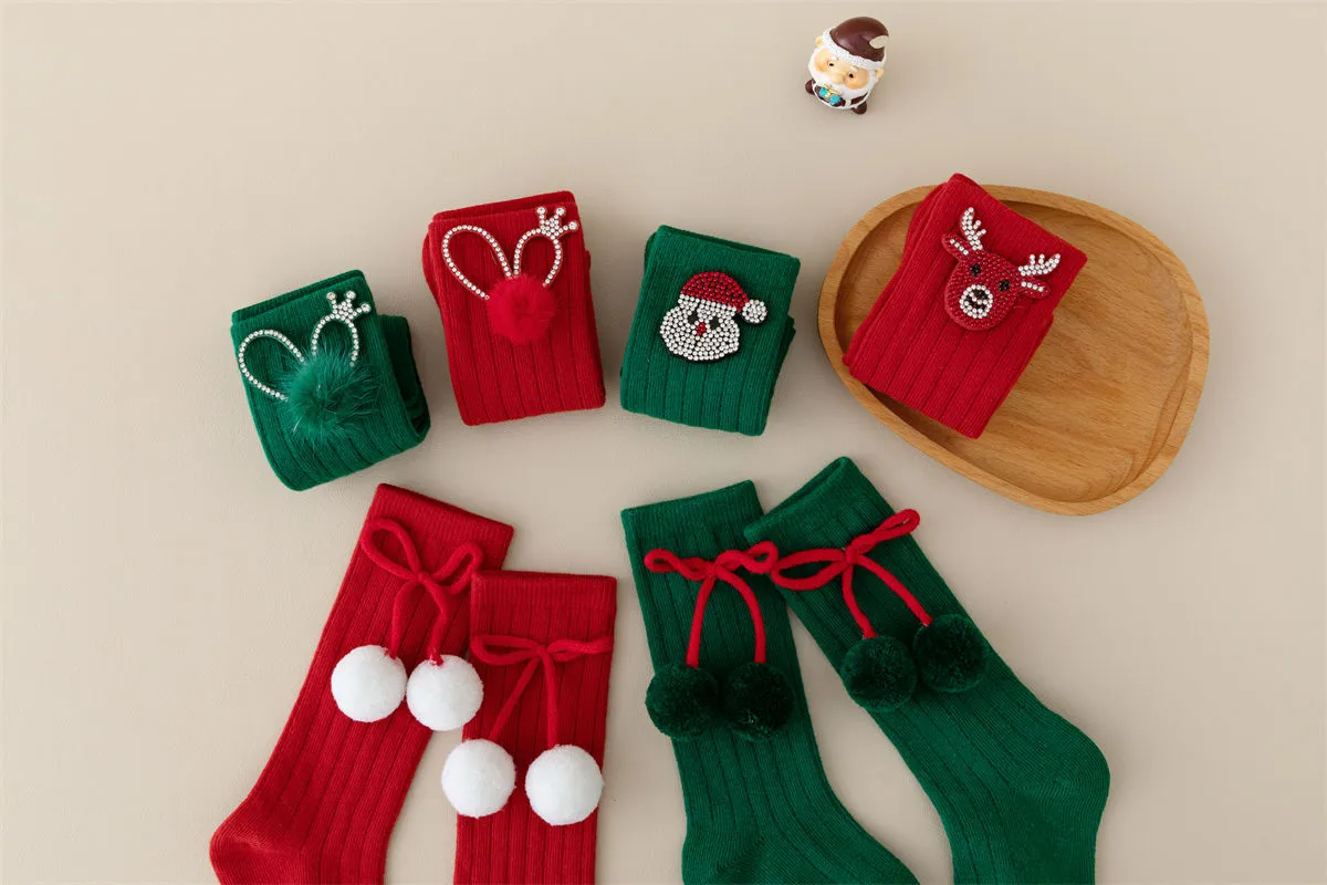 Bulk red and green Xmas knee high socks featuring cute pom poms and rhinestone characters. Bulk red and green Xmas knee high socks featuring cute pom poms and rhinestone characters.