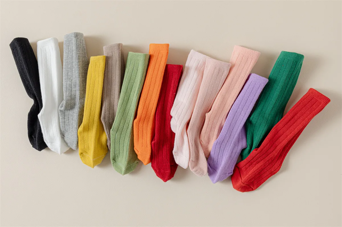 Bulk cotton baby socks in assorted colors, perfect for wholesale collections.